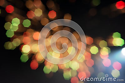 Defocused of beautiful polygon lights..Bokeh of multi colorful light in 7 polygon heptagon in smoky night background Stock Photo