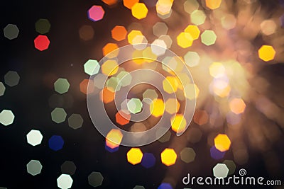 Defocused of beautiful polygon lights..Bokeh of multi colorful light in 7 polygon heptagon in smoky night background Stock Photo