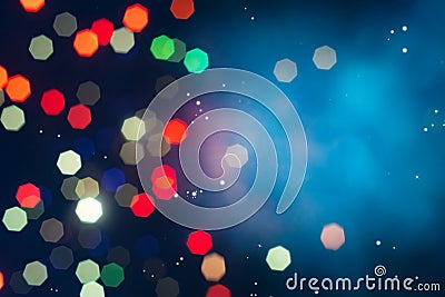 Defocused of beautiful polygon lights and light ray..Bokeh of colorful lighting in 7 polygon heptagon in smoky night background Stock Photo