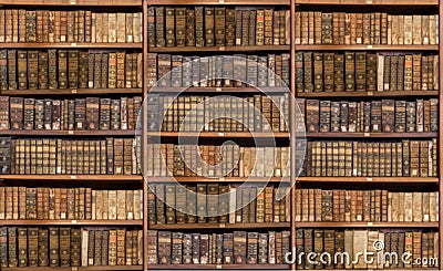 Defocused shelves of old antique books for background Stock Photo