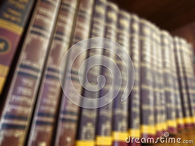 Defocused image. Multi-colored books on the bookshelf in the library. The bokeh effect Stock Photo