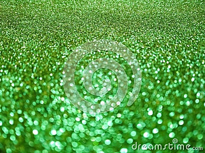 Defocused lights texture. Abstract bokeh lights. Shiny sparkle emerald metallic glitter texture. Glamorous luxurious color Stock Photo