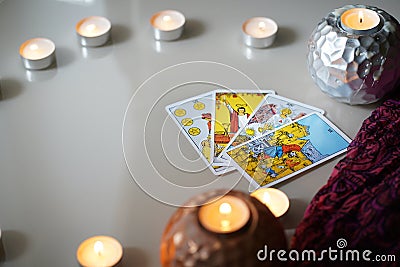 Defocused mystic ritual with tarot cards, and candles. Editorial Stock Photo