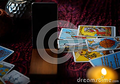 Defocused mystic ritual with tarot cards, and candles. Editorial Stock Photo