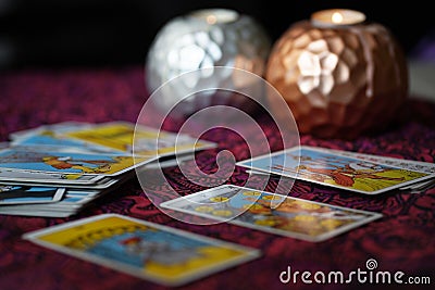 Defocused mystic ritual with tarot cards, and candles. Editorial Stock Photo