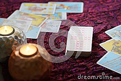 Defocused mystic ritual with tarot cards, and candles. Editorial Stock Photo