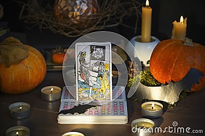 Defocused mystic ritual with tarot cards, and candles. Halloween concept Editorial Stock Photo