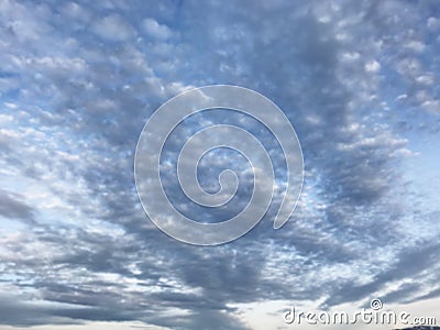 Defocused natural blue cloudscape landscape, cirrocumulus cloud form or pattern in bright day morning or afternoon sky background. Stock Photo