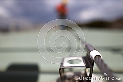 Defocused of rope access inspector technician inspecting fall arrest, fall restraint roof anchor point Stock Photo