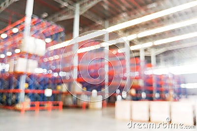 Defocused warehouse racks with cartons boxes as background Stock Photo