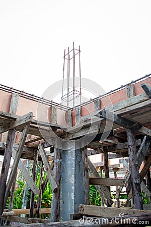 Deformed steel bars frame for beam reinforced steel footing or flooring in construction site. Stock Photo