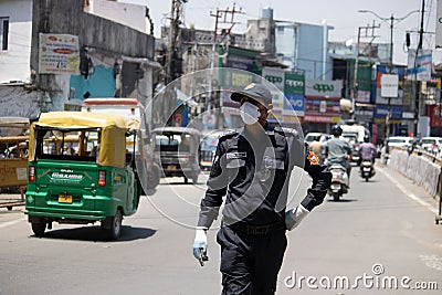 A Police man is on duty, wearing face mask Editorial Stock Photo