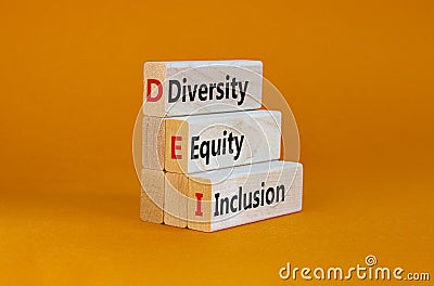 Diversity, equity, inclusion symbol. Wooden blocks with words DEI, diversity, equity, inclusion on beautiful orange Stock Photo