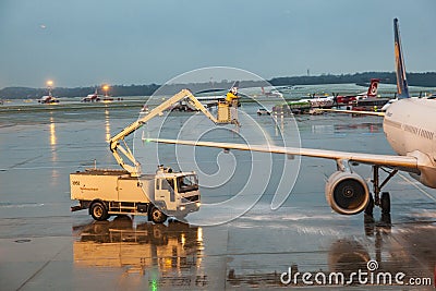 Deicing of the Lufthansa plane Editorial Stock Photo