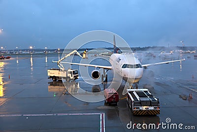 Deicing of the Lufthansa plane Editorial Stock Photo