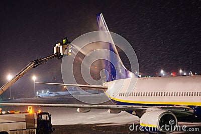 Deicing plane with glycol Editorial Stock Photo