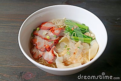 Delectable Roasted Pork Wonton and Egg Noodle Soup with Vegetables Stock Photo