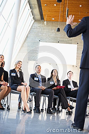 Delegates Listening To Speaker Stock Photo