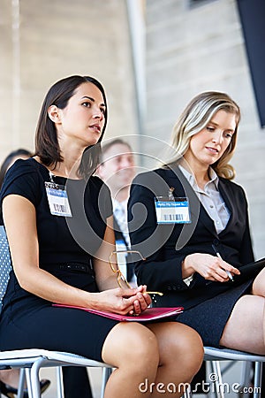 Delegates Listening To Speaker At Conference Stock Photo