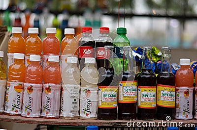 Delhi, India, 2020. Indian cold drink juices kept for display at a roadside vendor shop during summers. Local Soft drink brands Editorial Stock Photo