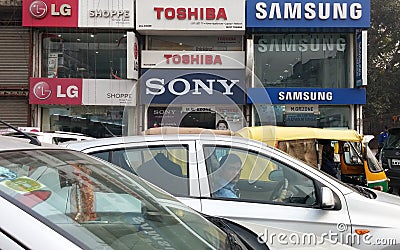 Delhi, India - LG, SONY, TOSHIBA, and SAMSUNG electronics stores side by side. Editorial Stock Photo