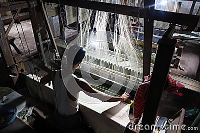 Man works as weaver in the carpet workshop Editorial Stock Photo