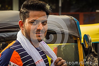 Delhi, India - March 19, 2019 : Indian auto rickshaw three wheeler tempo, taxi driver man Editorial Stock Photo