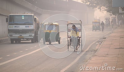Vehicles moving in the road amidst heavy smog in Delhi.. Editorial Stock Photo