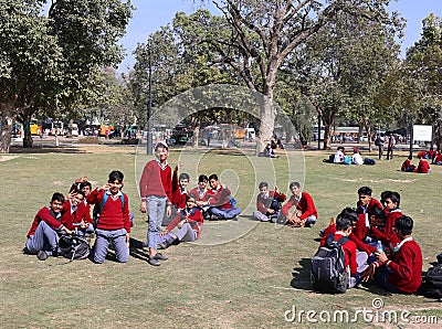 Unidentified local school boys in park of the India gate Editorial Stock Photo