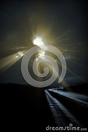 Deliberately Dark Lonely Road with light rays Stock Photo