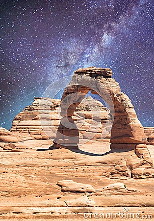 Delicate Arch as seen from lower point of view with milky way at night, Arches National Park, UT Stock Photo