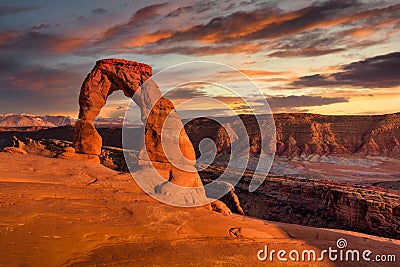 Delicate Arch at Sunset Under Stunning Skies Stock Photo