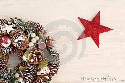 Delicate Christmas wreath of pine cones and a red star Stock Photo