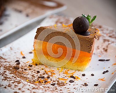 Delicate dessert from chocolate souffle and jelly from orange. Stock Photo