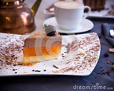 Delicate dessert from chocolate souffle and jelly from orange. Stock Photo