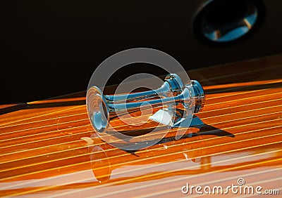 Delicate details of a hand made wooden boat. Polished metal horns Stock Photo
