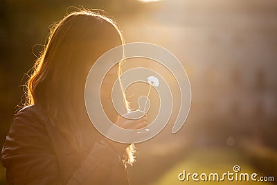 Delicate and fragile girl, sweet hope woman and nature. Romantic sunset. Stock Photo