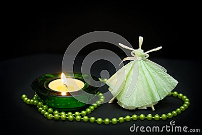 Delicate girl dancing at the flame of a candle Stock Photo