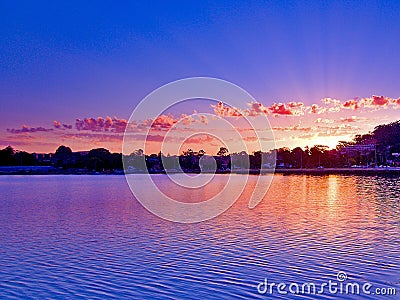 Pink cloudy Sunrise Seascape Australia Stock Photo