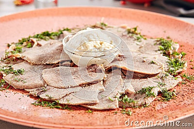 Delicatessen restaurant dish of thinly sliced boiled beef tongue Stock Photo