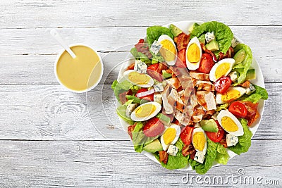 Delicious american cobb salad with dressing Stock Photo