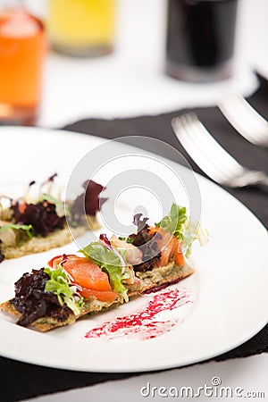 Delicious appetizer with shrimps on crispy bread Stock Photo