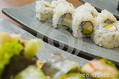 Delicious assorted Japanese sushi rolls on beautiful set up on table in traditional healthy Asian food and creative oriental Stock Photo