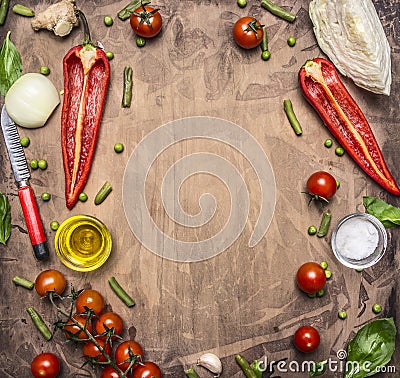 Delicious assortment of farm fresh vegetables cherry tomatoes, bell pepper, butter, cabbage, wooden salad spoon place text,fr Stock Photo