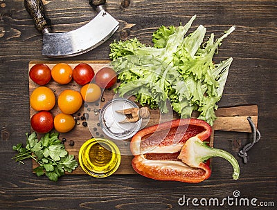 Delicious assortment of farm fresh vegetables on a cutting board wooden rustic background top view close up Stock Photo