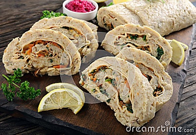 Delicious baked ground fish fillet roulade Stock Photo