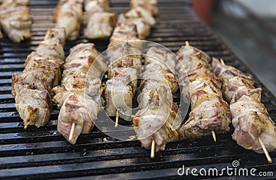 Delicious bbq grilling meat on open grill, outdoor kitchen. Food festival in city. tasty food roasting on skewers, food Stock Photo