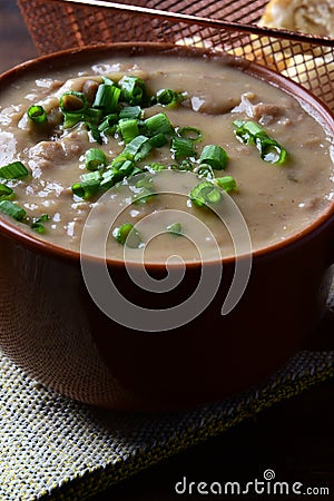 delicious bean broth with bacon, bread and pepper, typical Brazilian food Stock Photo