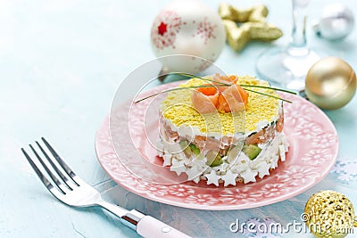 Delicious and beautiful layered salad with salted salmon, avocado, boiled egg and rice Stock Photo