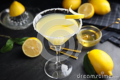 Delicious bee`s knees cocktail and ingredients on black table Stock Photo